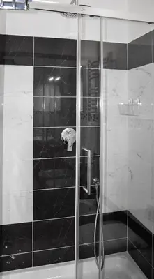 a shower with a glass door in a bathroom at Good Life Via Veneto in Rome