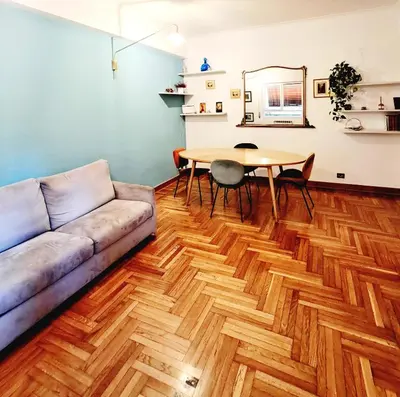 a living room with a couch and a table at RoRo Roma in Rome