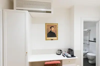 a bathroom with a sink and a toilet at Relais Donna Lucrezia in Rome