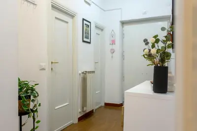 a bedroom with a large bed and two night stands at Florje House in Rome