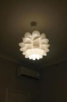 a chandelier hanging from a ceiling in a room at Alfieri home holiday in Rome