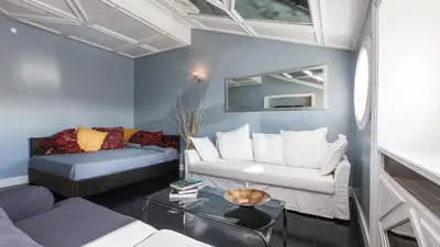 a living room with a couch and a table at Rental in Rome Flaminio View Suite in Rome