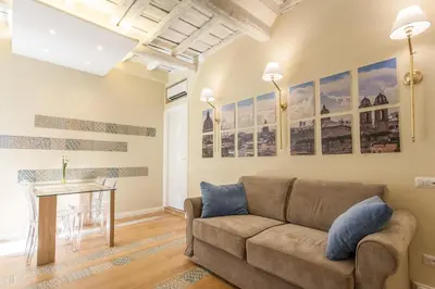 a living room with a couch and a table at Boschetto 124 Apartment in Rome