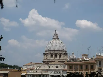 a view of the dome of a building at Ferrari al Vaticano in Rome