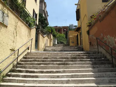 a set of stairs in an alleyway between buildings at Ferrari al Vaticano in Rome