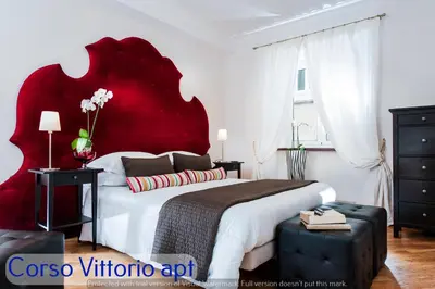 a bathroom with a sink and a toilet and a mirror at Corso Vittorio Apartments in Rome