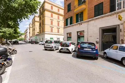 a group of cars parked on the side of a street at Appartamenti con vista Piazza Testaccio in Rome