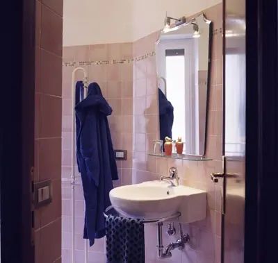 a bathroom with a sink and a mirror at B&B Buongiornoroma in Rome