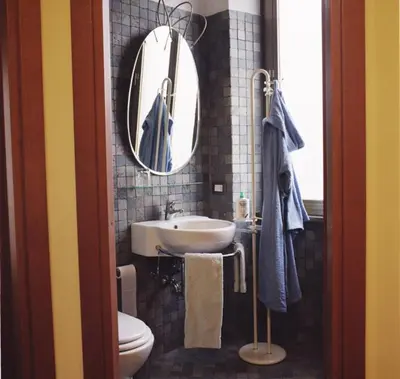 a bathroom with a sink and a mirror and a toilet at B&B Buongiornoroma in Rome