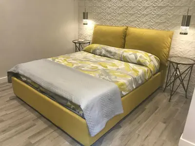 a bedroom with a bed with two tables at Rome Studio Rental in Rome