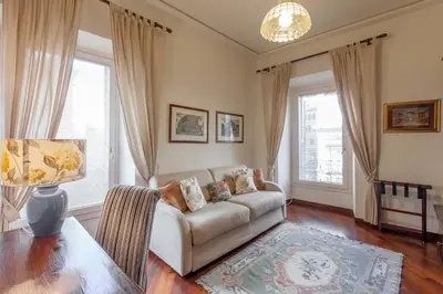 a living room with a couch and a table at Rent Home In Rome in Rome