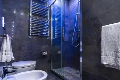 a bathroom with a shower and a toilet and a sink at Les Diamants in Rome