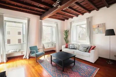 a living room with a couch and a table at Farnese Apartment 1870 in Rome