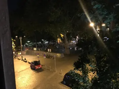 a car parked in a parking lot at night at Locanda San Cosimato in Rome