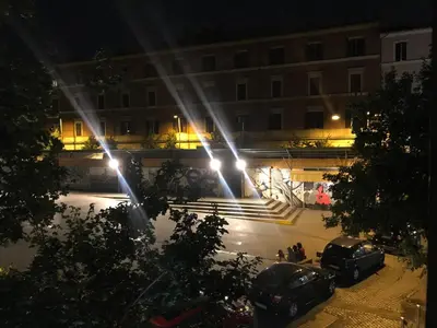 a view of a building at night with lights at Locanda San Cosimato in Rome