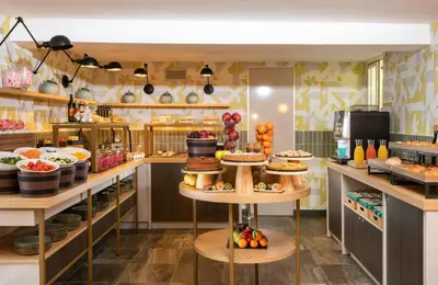 a bakery with many different types of food on display at Leonardo Boutique Hotel Rome Termini in Rome