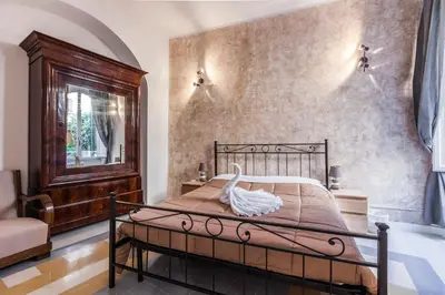 a bedroom with a bed with a swan on it at The Sweet Terrace in Rome