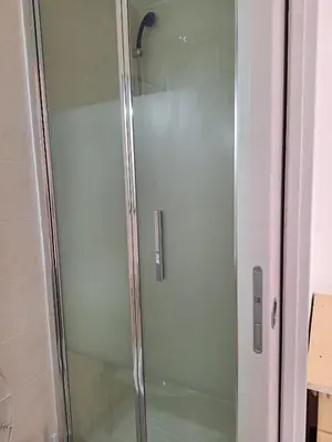 a shower with a glass door in a bathroom at Casa Fanti 57 in Rome