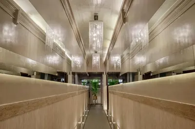 a hallway in a building with lights on the ceilings at Stay Inn Rome Via Del Corso in Rome