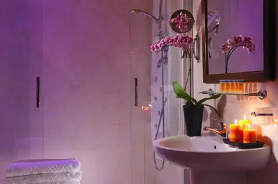 a bathroom with a sink and a shower with a sink at Hotel Tuscolana in Rome