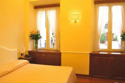 a hallway with a wooden door in a room at Luxury Ludovisi Rooms in Rome