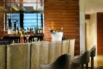a bar in a restaurant with a bunch of drinks at UNA Hotels Decò Roma in Rome