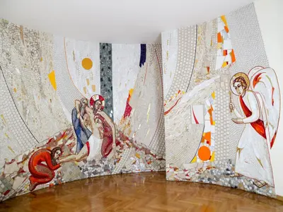 a room with three paintings on the wall at Roma Room Hotel in Rome