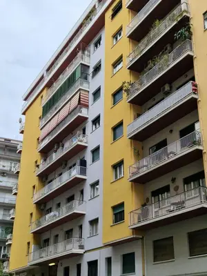 a yellow apartment building with balconies at Casanova in Rome