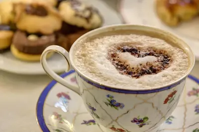 a cup of cappuccino with a heart in the foam at Hotel Residenza In Farnese in Rome