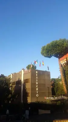 a hotel with flags on top of a building at Hotel Desiderio in Rome