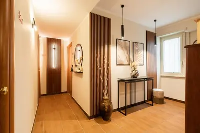 a hallway with a vase on a table at AlbaDomus Affittacamere o GuestHouse in Rome