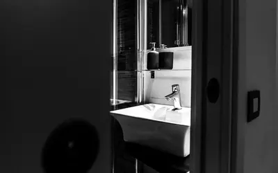 a bathroom with a white sink and a mirror at B&B Saint Paul in Rome