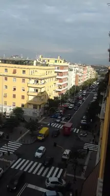 a city with cars parked in a parking lot at Room 14 in Rome
