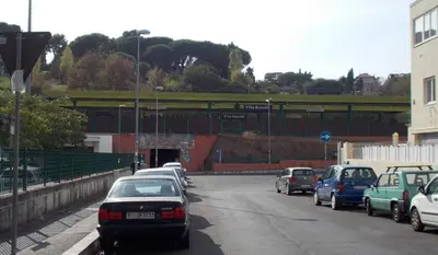 a group of cars parked on a road with a tunnel at Roma Tourist House in Rome
