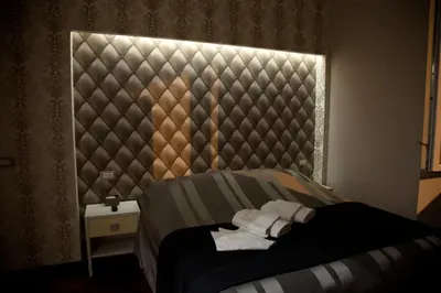 a bedroom with a bed with two towels on it at Maison Imperiale in Rome