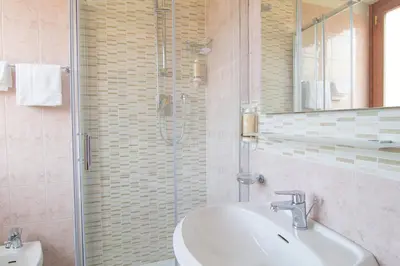 a bathroom with a sink and a shower at Hotel Pacific in Rome