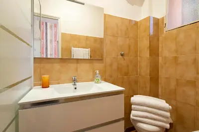 a bathroom with a sink and a toilet at Rome La Sapienza Apartment in Rome