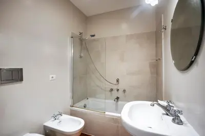 a bathroom with a sink and a tub and a toilet at Gatsby Guest House - Zen 60 in Rome