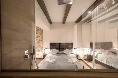 a bedroom with a large glass window with a bed at Trinità dei Monti Suite in Rome