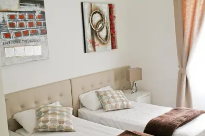 a bedroom with two beds and a window at Nonna grazia in Rome