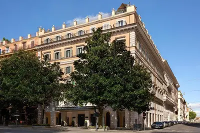 a large building with a tree in front of it at Nobu Hotel Roma in Rome