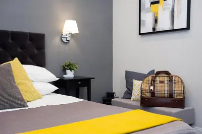 a bedroom with a bed with a bird cage on it at Maison Boncompagni in Rome