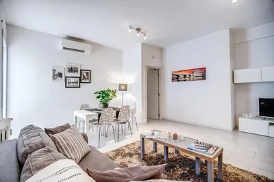 a living room with a couch and a table at Vaticanum Modern & Family Apartment in Rome