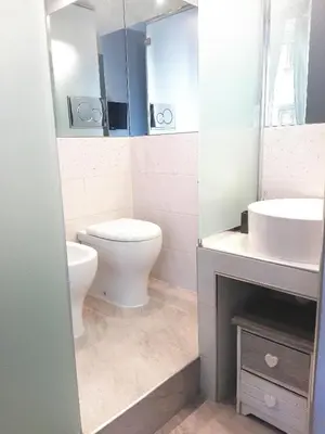 a bathroom with a toilet and a sink at Aleardo Aleardi in Rome
