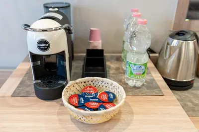 a food processor sitting next to a bowl of candy at Leone D'Oro GUESTHOUSE - close to Piazza Vittorio in Rome