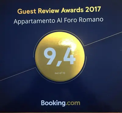 a gold circle with the text quest review awards appendendarota al toronto at Foro Romano Apartments A in Rome