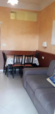 a living room with a couch and a table at Filiberto Apartment in Rome