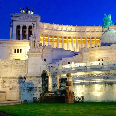 a building with a statue in front of it at Your secret place in Rome in Rome