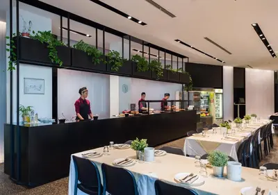 a dining room with tables with people in the background at Camplus Pietralata - Casa per Ferie in Rome