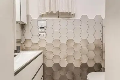 a bathroom with a toilet and a sink at Costaguti 36 Apartment in Rome